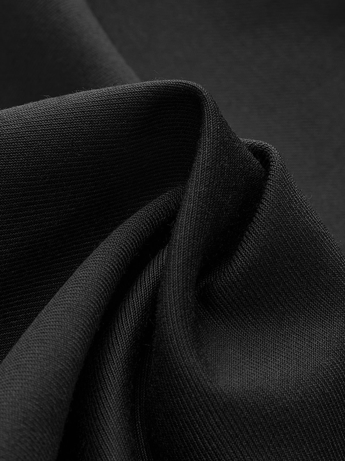 Široké kalhoty s knoflíkem na asymetrickém lemu